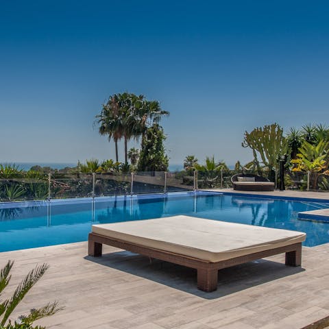 Sip sangria by your private infinity pool with sweeping ocean views