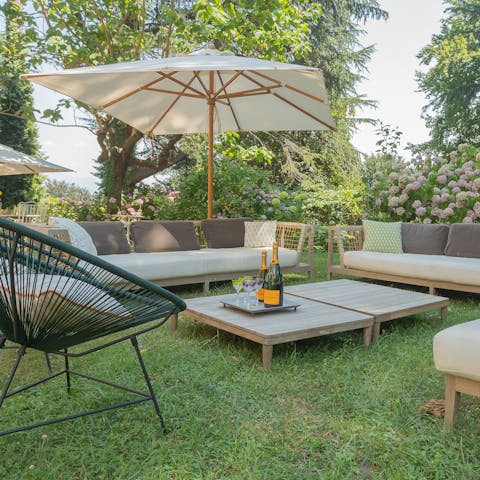 Savour a glass of Italian wine served in the garden