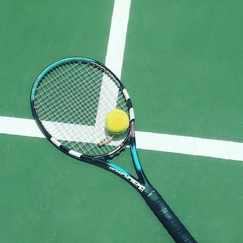 Show off your groundstrokes on the villa's private tennis court