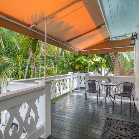 Enjoy drinks on the shared terrace, surrounded by bright green