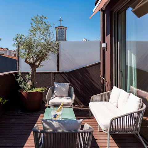 Enjoy a glass of Portuguese wine on the sunny balcony