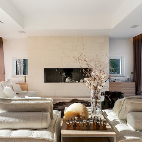Relax in the modern living space as the natural sunlight pours in