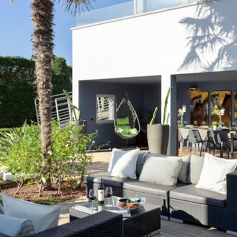 Dine alfresco on the palm-lined patio terrace