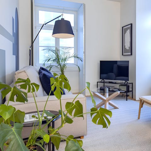 Relax in the stylish living area with a glass of Portuguese wine