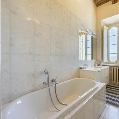 Finish the day with a well-earned soak in the sleek bathtub