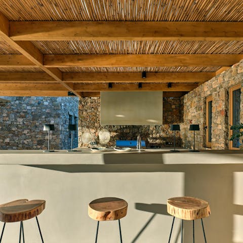 Mix up a batch of sundowners in the full outdoor kitchen and bar