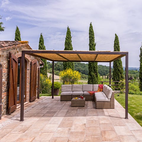 Lounge with a good book on the comfy outdoor sofa