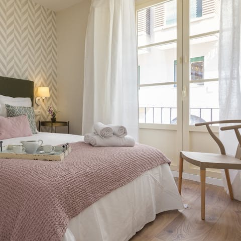 Enjoy a duvet day with a book as the daylight streams in