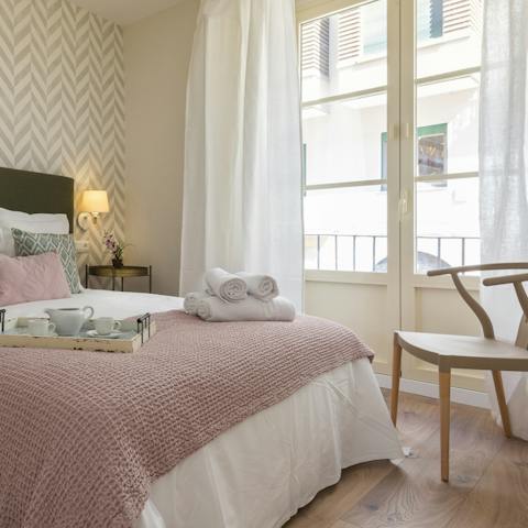 Enjoy a duvet day with a book as the daylight streams in