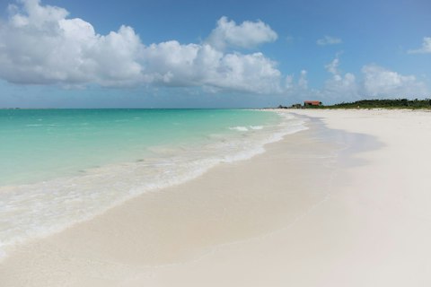 Unwind on the soft sands of Long Bay Beach, just footsteps away
