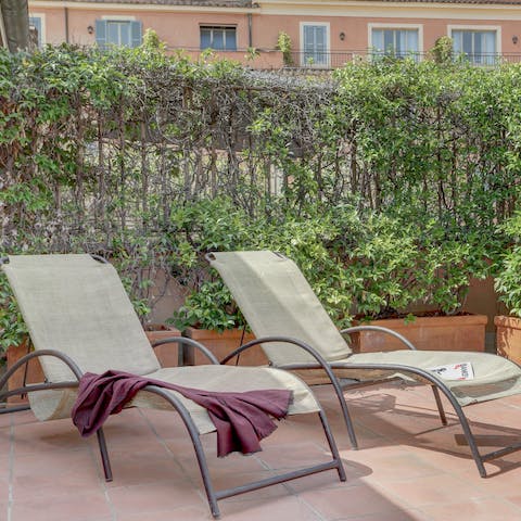 Lounge out on the sun beds, surrounded by greenery, with your new read