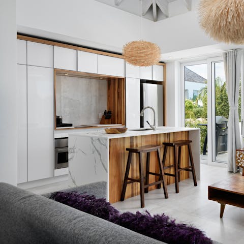 Rustle up your favourite meals in the sleek marble kitchen