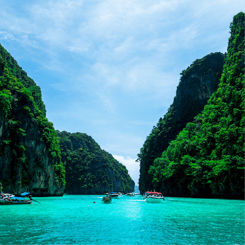 Explore Phuket's stunning natural beauty as you traverse its azure waters & luscious vegetation