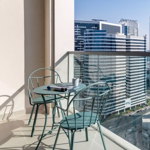 Enjoy your morning coffee in the bliss of Dubai's sunshine on the balcony