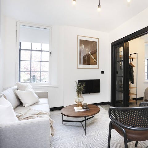 Kick back with a glass of wine in the bright living room after a day of exploring your Old Town neighbourhood
