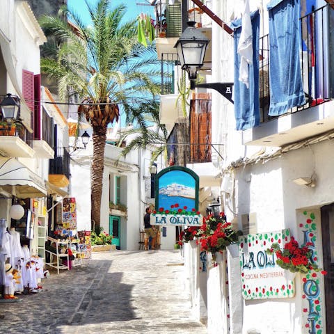 Explore Ibiza Town, a thirty-minute ride away