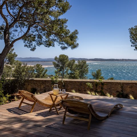 Sip cold cocktails with sparkling sea views