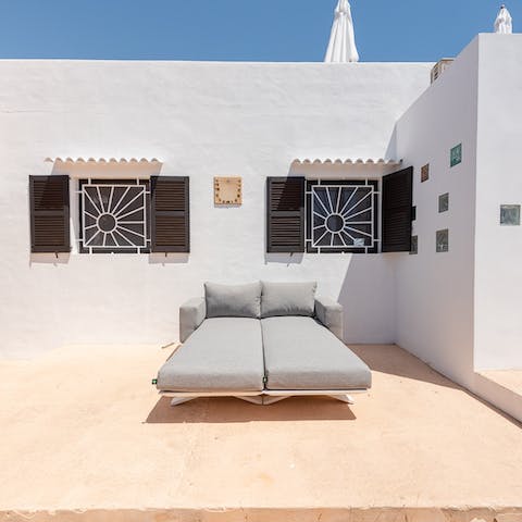 Stretch out on the daybeds for a spot of stargazing