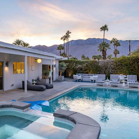 Enjoy a private backyard with pool, fire pit and mountain views