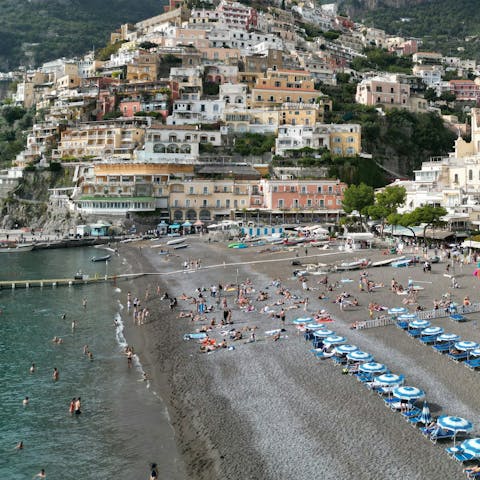 Lounge under the Italian sun at Positano beach, thirteen-minute walk away