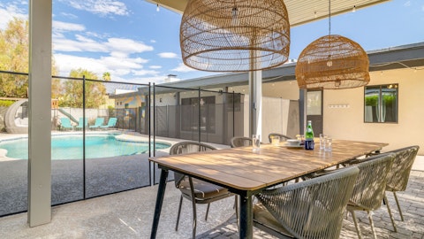 Dine alfresco steps from the private pool