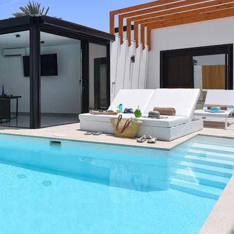 Spend a lazy afternoon working on your tan with a good book