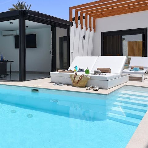 Spend a lazy afternoon working on your tan with a good book