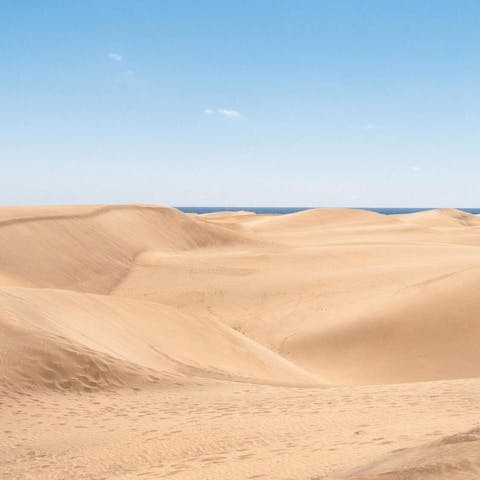 Take a stroll over the sand as you head to the sea at Dunas de Maspalomas