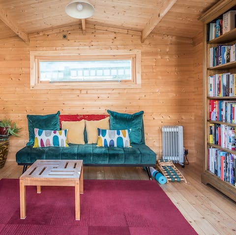 Relax in the summer house with a book from the home library