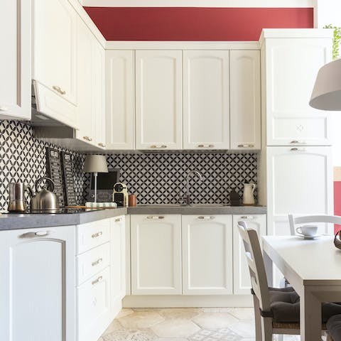 Cook up meals at home in the pretty tiled kitchen