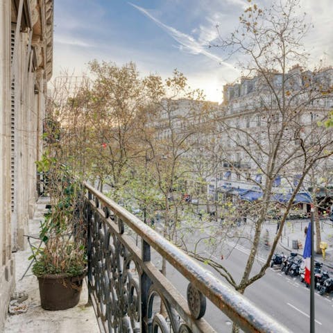Step onto the balcony for fresh air and street views