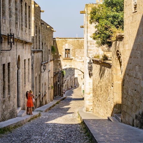 Walk down the cobbled path of the Street of Kings – a fourteen minute drive away