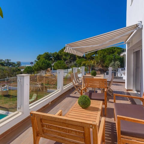 Sit out on the balcony with drinks and spy the sunset over the sea