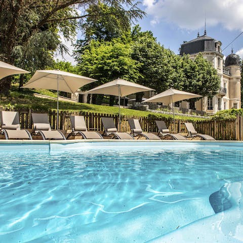 Splash about in the heated swimming pool before drying off on one of the sun beds