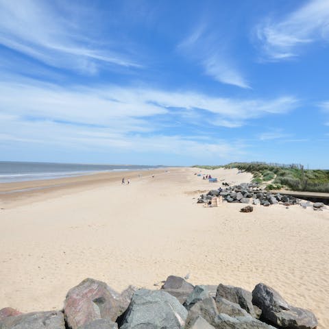 Stroll along the soft sands of Brancaster Beach, a short car ride away