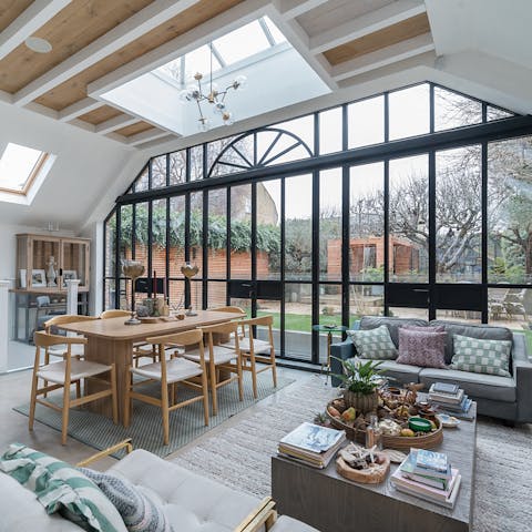 Admire apple tree views through stunning floor-to-ceiling windows