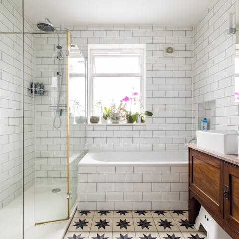 Treat yourself to a relaxing soak in the gorgeous metro-tiled tub