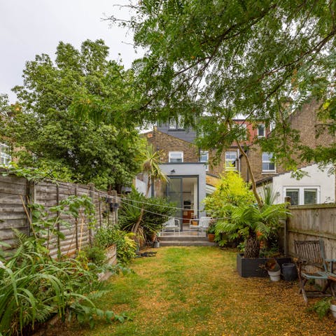 Soak up some sun in the leafy garden – there's a trampoline here too for little ones