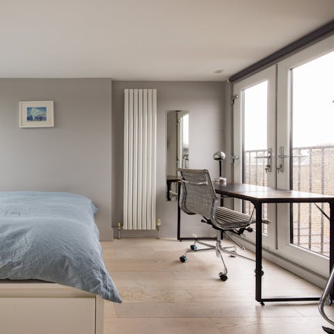 Open the French doors to let the breeze flow in as you catch up on work at the desk space