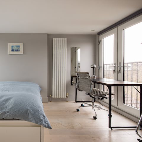 Open the French doors to let the breeze flow in as you catch up on work at the desk space