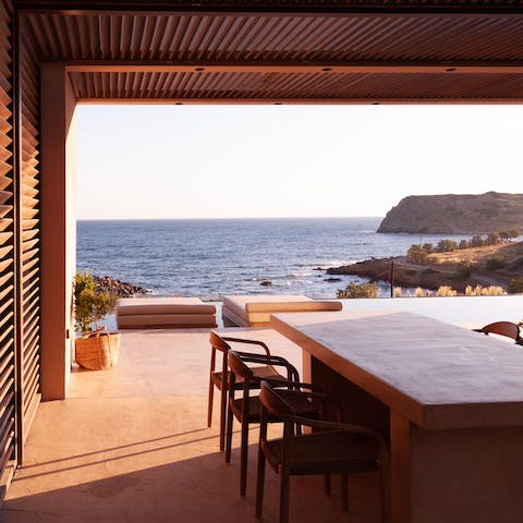 Appreciate the amazing coastal views, as you enjoy an alfresco dinner