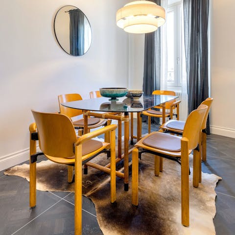 Share some delicious meals and Italian wine at the dining table