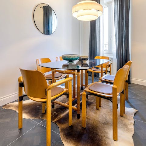 Share some delicious meals and Italian wine at the dining table