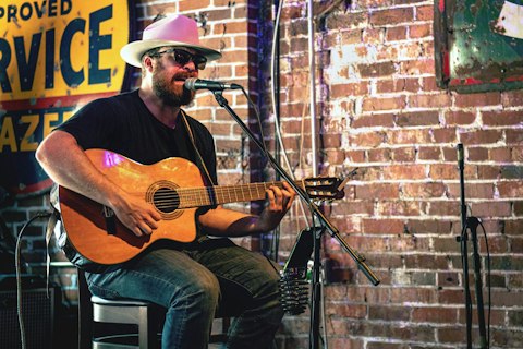 Experience Nashville's intimate live music culture at a world-famous songwriter showcase