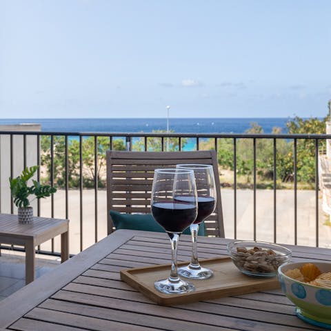 Relax on the private balcony with views over the sea