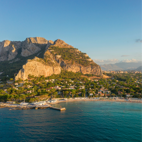 Walk along the Mondello beach at sunset