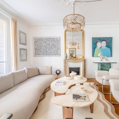 Sip coffee in the double living room after visiting the Louvre