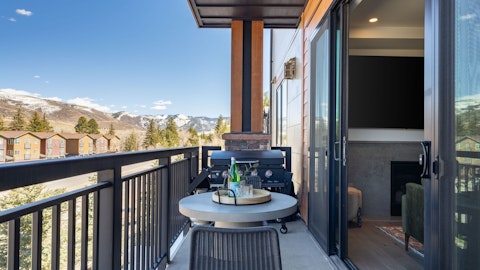 Grill alfresco with sweeping views of snow-capped summits all around you