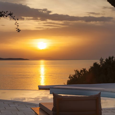 Sip a cocktail at sunset as the sea takes on honey-coloured hues