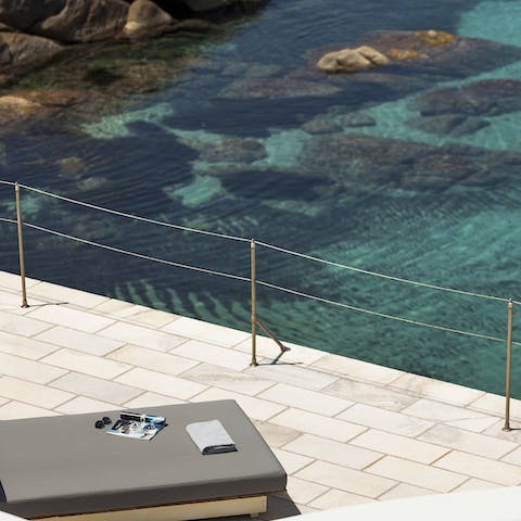 Sunbathe with views over the Aegean